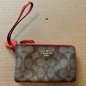Tan and Orange Coach Wristlet